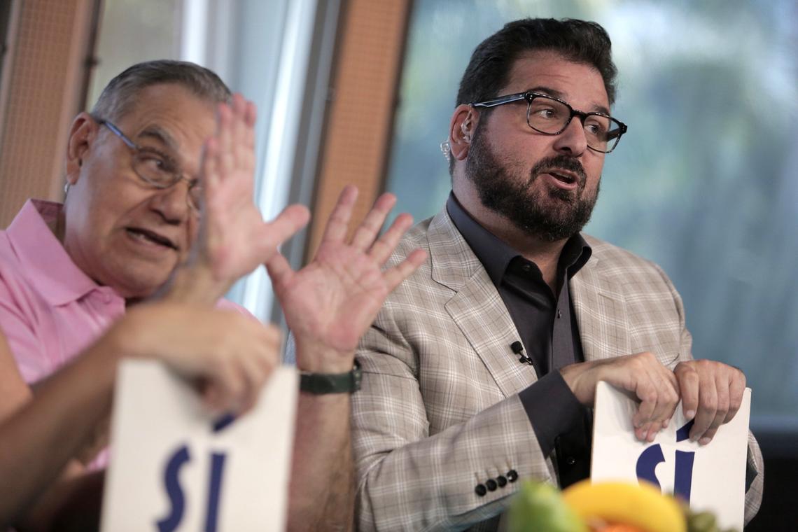 Miami Beach, Florida, December 18, 2018- Dan Le Batard (right) in the ESPN studios at The Clevelander Hotel in South Beach during taping for his TV show, Highly Questionable. Papi (Dan Le Batard’s father, left) is also pictured.