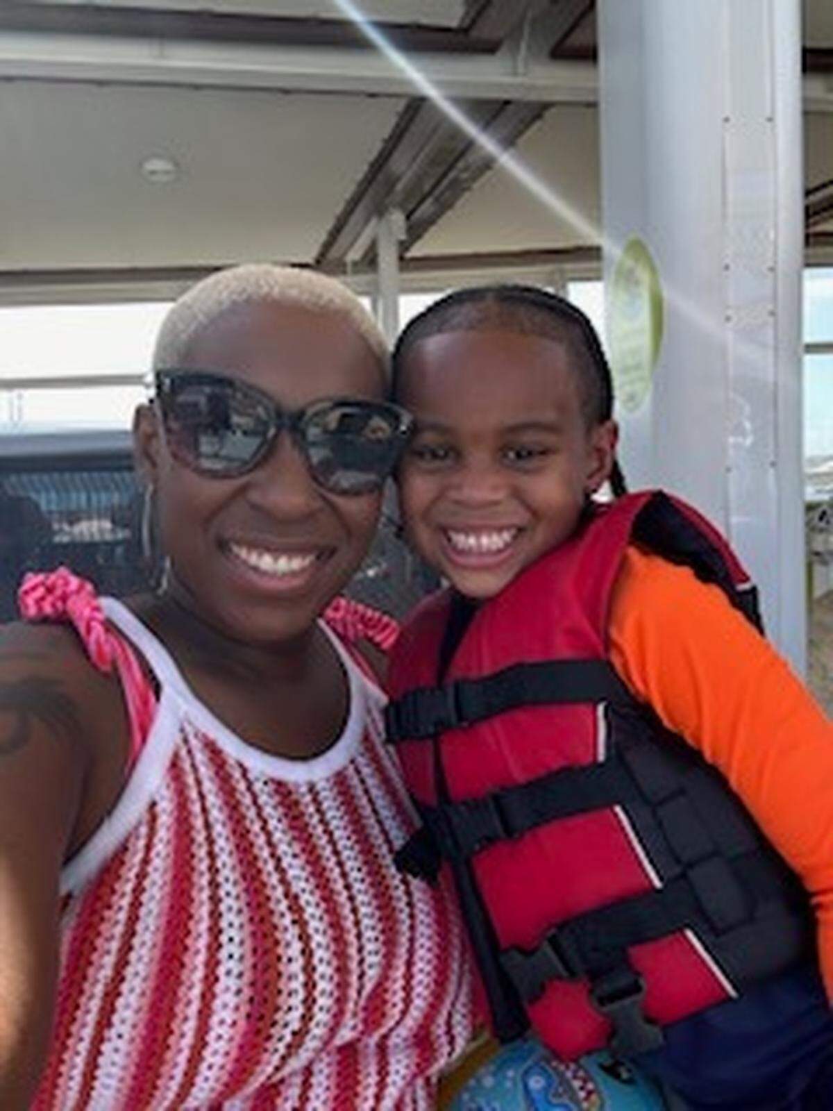 Esha Dawkins and her son Sam pose in this undated photo. Esha Dawkins was shot in the neck while driving on Interstate 95 on Nov. 25, 2024, in what investigators believe was a road rage shootout in which she was an innocent bystander.