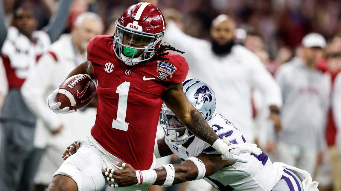 Alabama running back Jahmyr Gibbs (1) is tackled by Kansas State safety Drake Cheatum (21) as he carries the ball during the first half of the Sugar Bowl NCAA college football game Saturday, Dec. 31, 2022, in New Orleans. (AP Photo/Butch Dill)