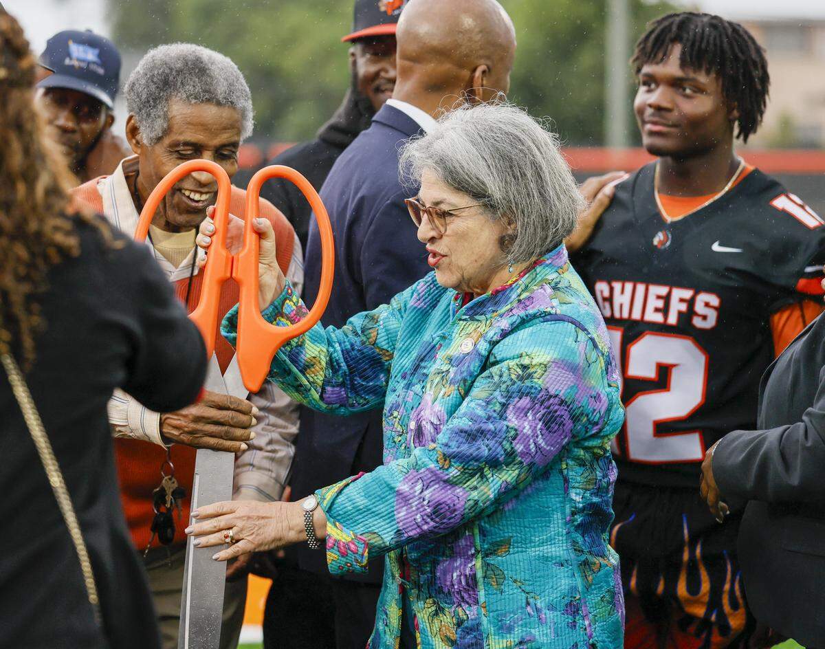 Miami-Dade County Mayor Daniella Levine Cava joins Walt Frazier for a ribbon-cutting ceremony to open Orange Bowl Field at Walt Frazier Park on Tuesday, January 13, 2026 in Miami Gardens, Florida. The $2.3 million renovation includes a synthetic football field, an electronic scoreboard, and other refurbishments.