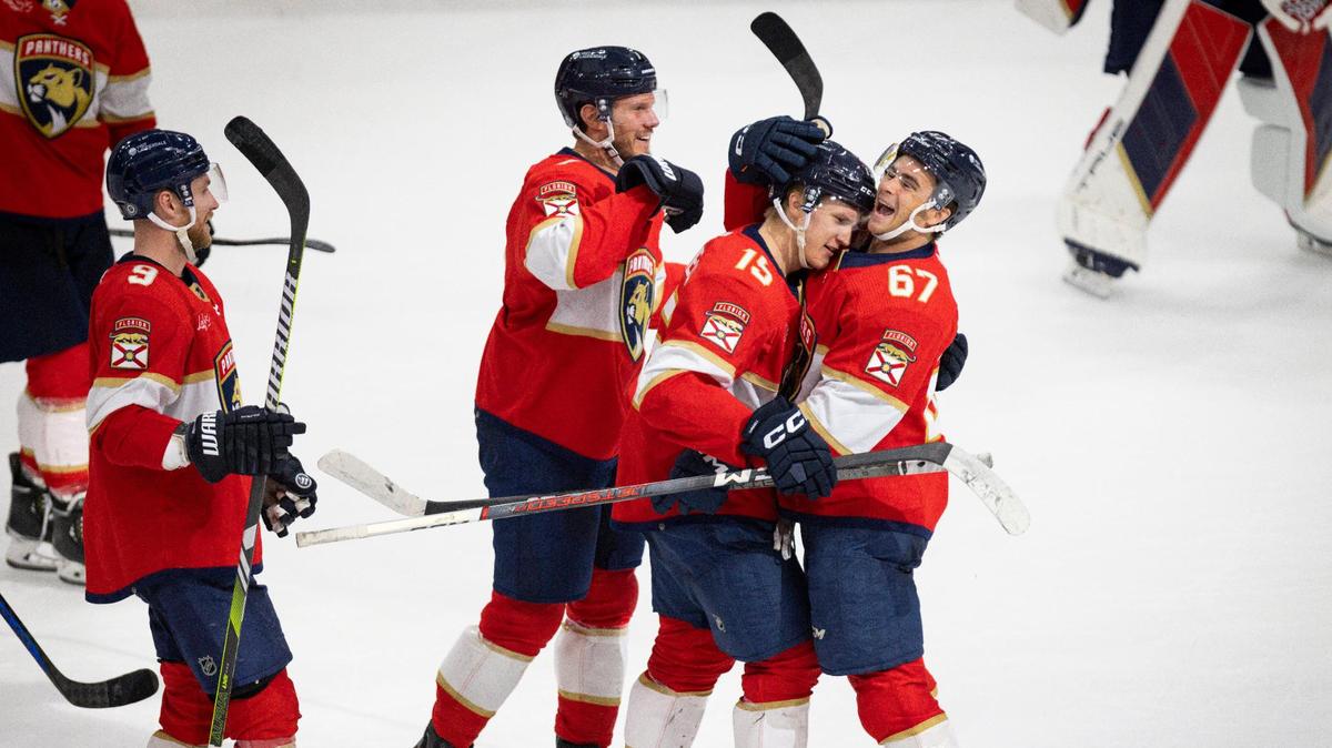 Florida Panthers right wing William Lockwood (67) hugs center Anton Lundell (15) after Lundell scored the game winning goal in a shootout round during a hockey game on Thursday, Feb. 29, 2024, at Amerant Bank Arena in Sunrise, Fla. The Florida Panthers won 4-3 in a shootout round following a tie in overtime.