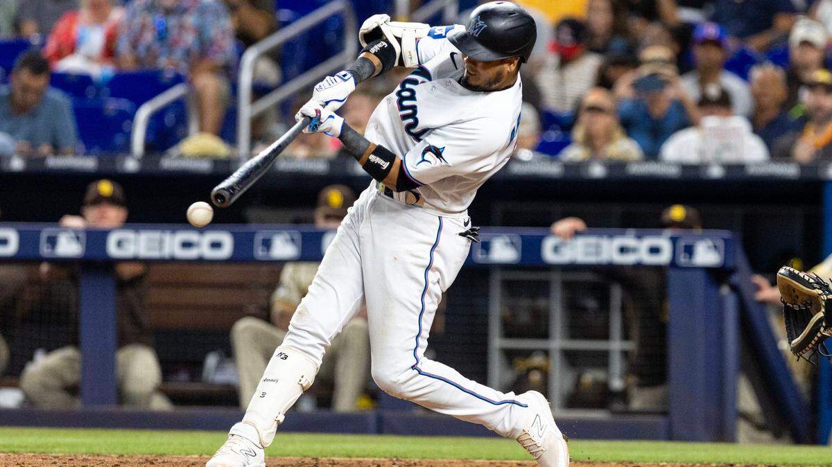 Miami Marlins batter Luis Arraez (3) singles on a ground ball during the sixth inning of an MLB game against the San Diego Padres at loanDepot park in the Little Havana neighborhood of Miami, Florida, on Thursday, June 1, 2023.