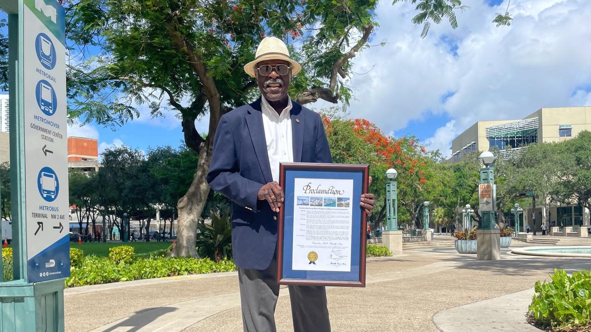 Wilbur Bell holds the county proclamation honoring his family history presented to him by the Miami-Dade County Commission and Mayor Daniella Levine Cava on Tuesday, June 18, 2024.