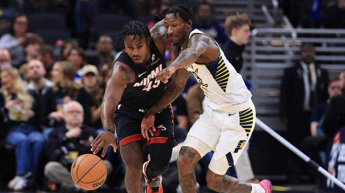 Davion Mitchell #45 of the Miami Heat brings the ball up the court against Quenton Jackson #29 of the Indiana Pacers during the first half at Gainbridge Fieldhouse on January 10, 2026 in Indianapolis.