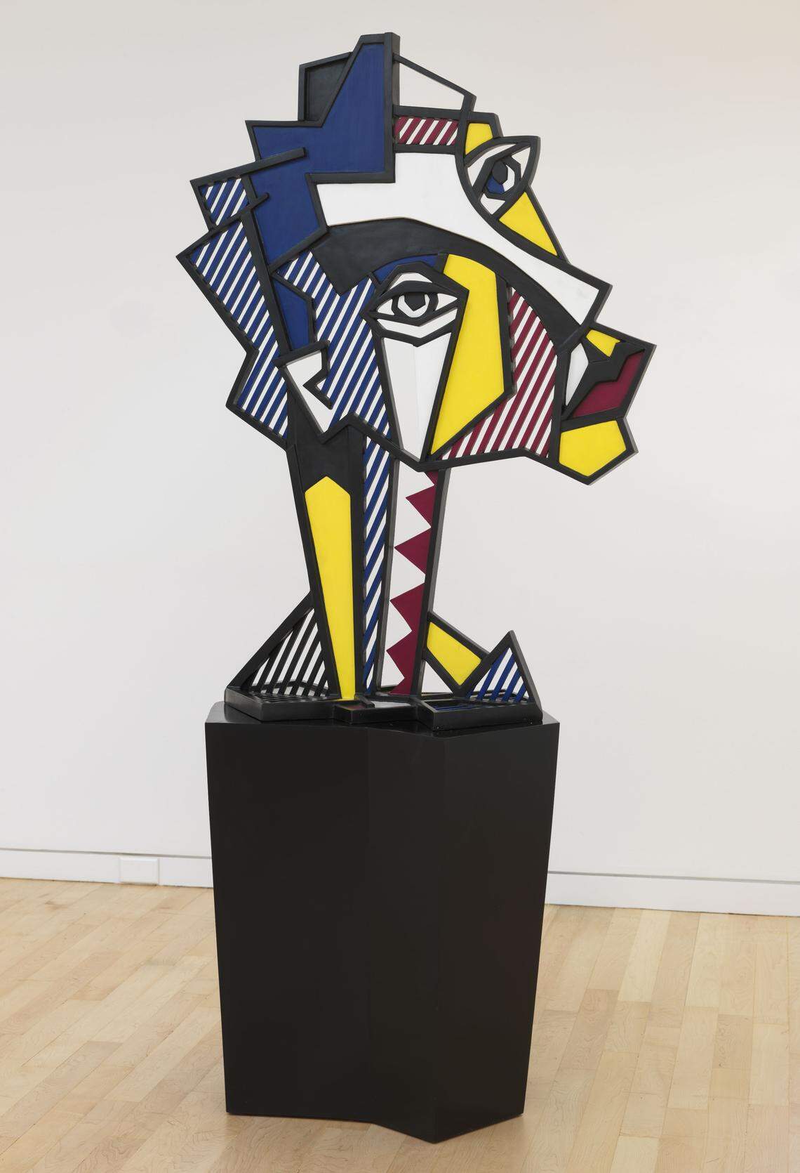 ROY LICHTENSTEIN’s “Expressionist Head,” 1980. Painted and patinated bronze with painted wooden base; 55 x 41 x 18 in.Edition of 6. Part of the “Pop Minimalism / Minimalist Pop” show by Jeffrey Deitch and Gagosian at the Moore Building in the Miami Design District, December 2018.