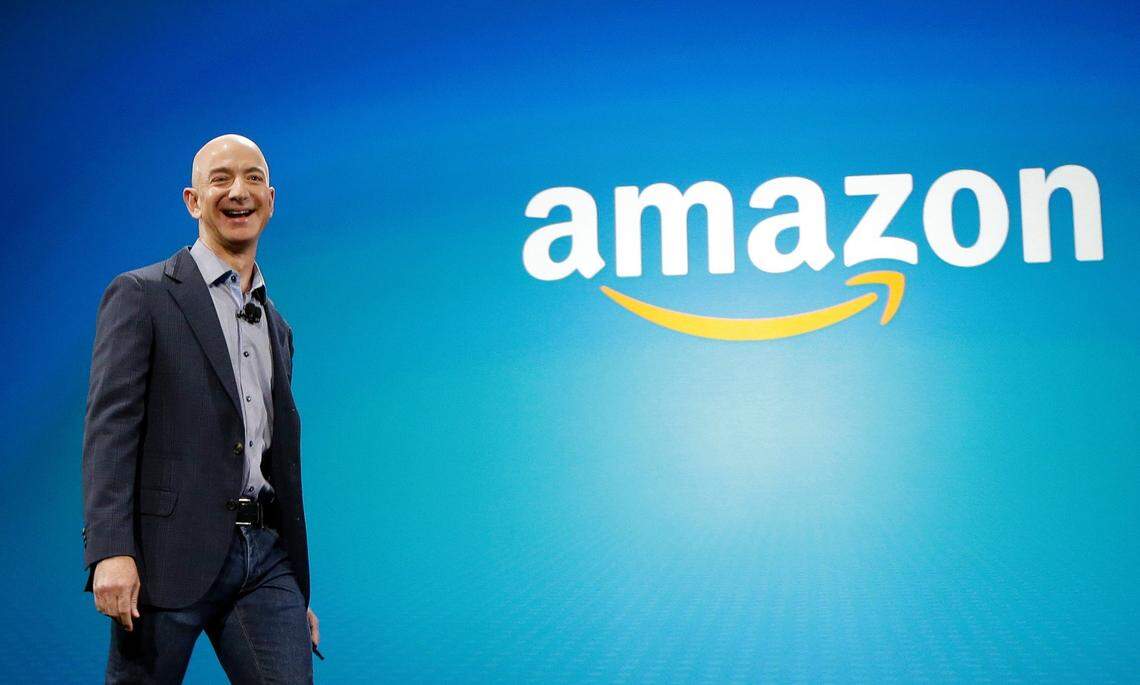 In this June 16, 2014, file photo, Amazon CEO Jeff Bezos walks onstage for the launch of the new Amazon Fire Phone, in Seattle.