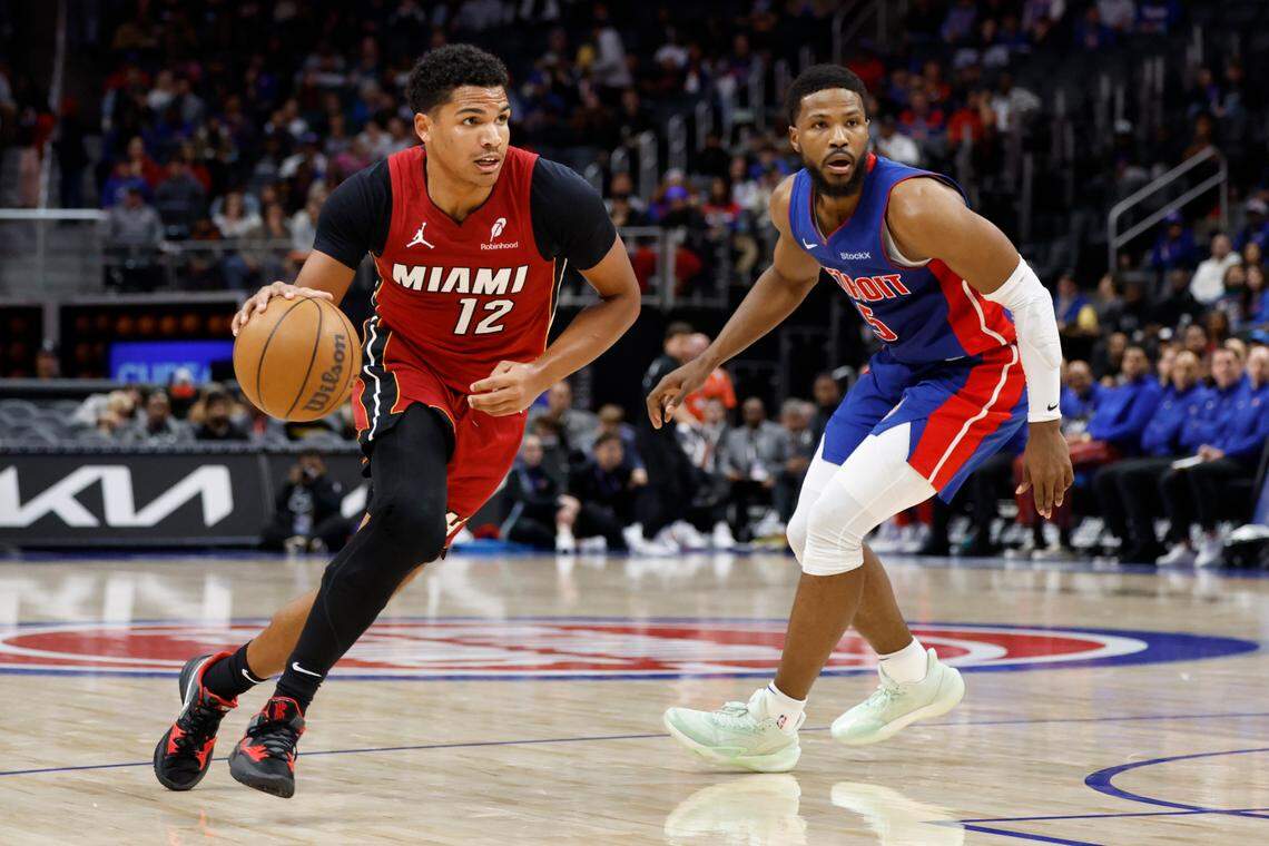Miami Heat guard Dru Smith (12) dribbles past Detroit Pistons guard Malik Beasley (5) in the first half at Little Caesars Arena.