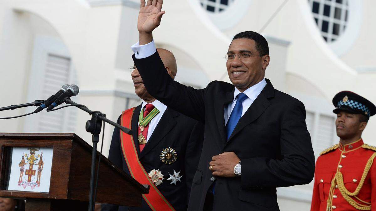 Jamaican Prime Minister Andrew Holness waves to the crowd after being sworn into office, in Kingston, Jamaica, on March 3, 2016.