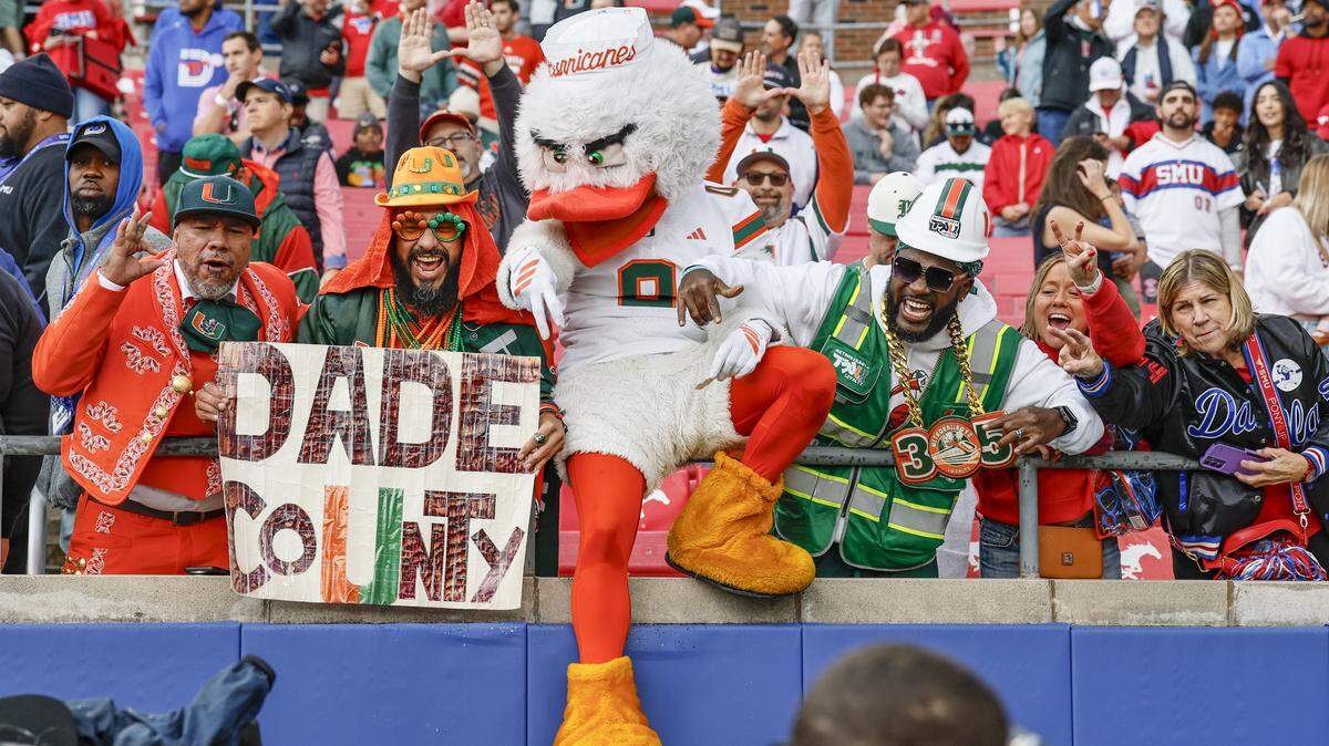 Miami Hurricanes and Southern Methodist University Mustangs fans show their support during the first half of an NCAA football game at Gerald Ford Stadium on Saturday, November 1, 2025, in Dallas, Texas.
