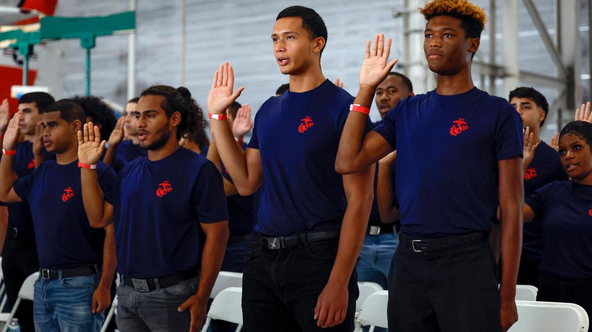 Recruits are sworn in during a ceremony at the National Salute to America’s Heroes presented by Hyundai Air & Sea Show/U.S. Army Salute Fest at the US Coast Guard Air Station in Opa-locka, Florida on Friday, May 26, 2023.