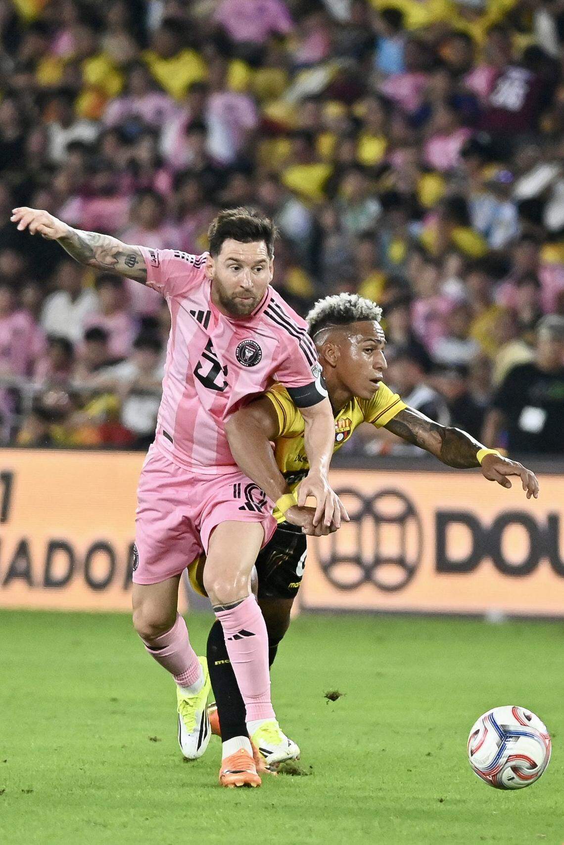 Inter Miami's Argentine forward #10 Lionel Messi and Barcelona's defender #07 Jandry Gomez fight for the ball during the friendly football match between Ecuador's Barcelona and the US' Inter Miami at the Banco Pichincha Stadium in Guayaquil, Ecuador, on February 7, 2026. (Photo by Marcos PIN / AFP via Getty Images)