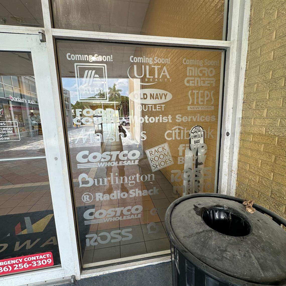 A Midway Crossings’ mall entrance window touts coming attractions for 2024 that include an Aldi, a Micro Center and an Ulta Beauty, along with established stores like a Burlington, Ross, Costco, Radio Shack and Five Below.