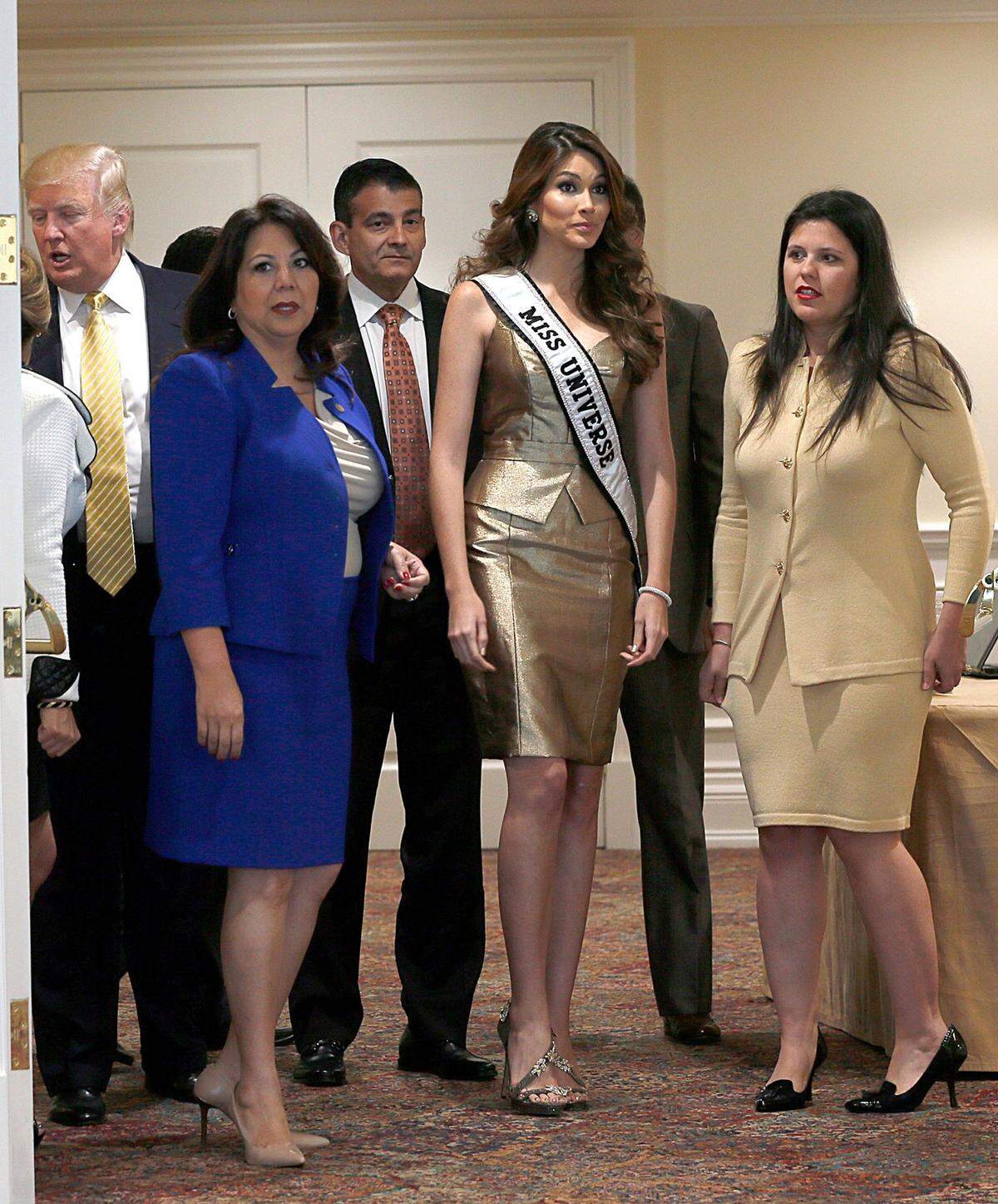 Donald Trump and contingent with Miss Universe 2013, Gabriela Isler, at a news conference to announce that the 63rd annual Miss Universe Pageant 2014, will take place in West Miami-Dade.