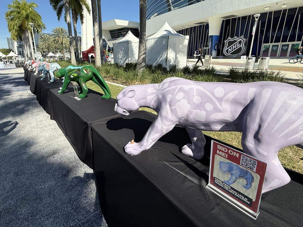Panther statues from Florida Panthers president of hockey operations and general manager Bill Zito’s “Panthers on the Prowl” fundraiser line the West Plaza at loanDepot park on Friday, Jan. 2, 2026, prior to the NHL’s Winter Classic in Miami, Florida.