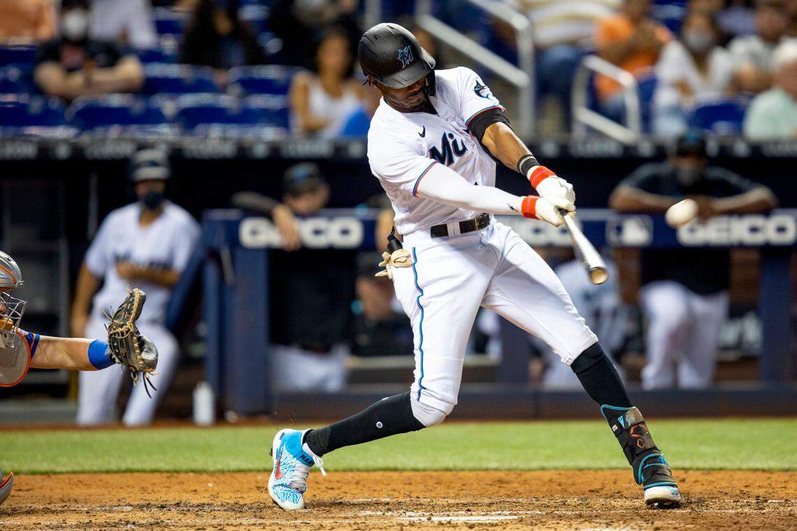 Miami Marlins batter Lewis Brinson (38) swings at a pitch during the eighth inning of an MLB game against the New York Mets at loanDepot park in the Little Havana neighborhood of Miami, Florida, on Tuesday, August 3, 2021.