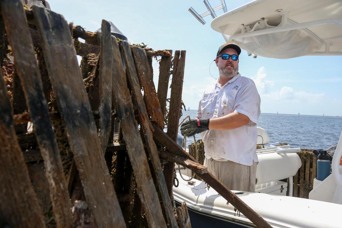 Capt. Spencer Crowley docks at Matheson Hammock Park & Marina on a boat loaded with abandon crab and lobster traps during the Ghost Trap Rodeo event in Coral Gables, Florida, Sunday, July 16, 2023.
