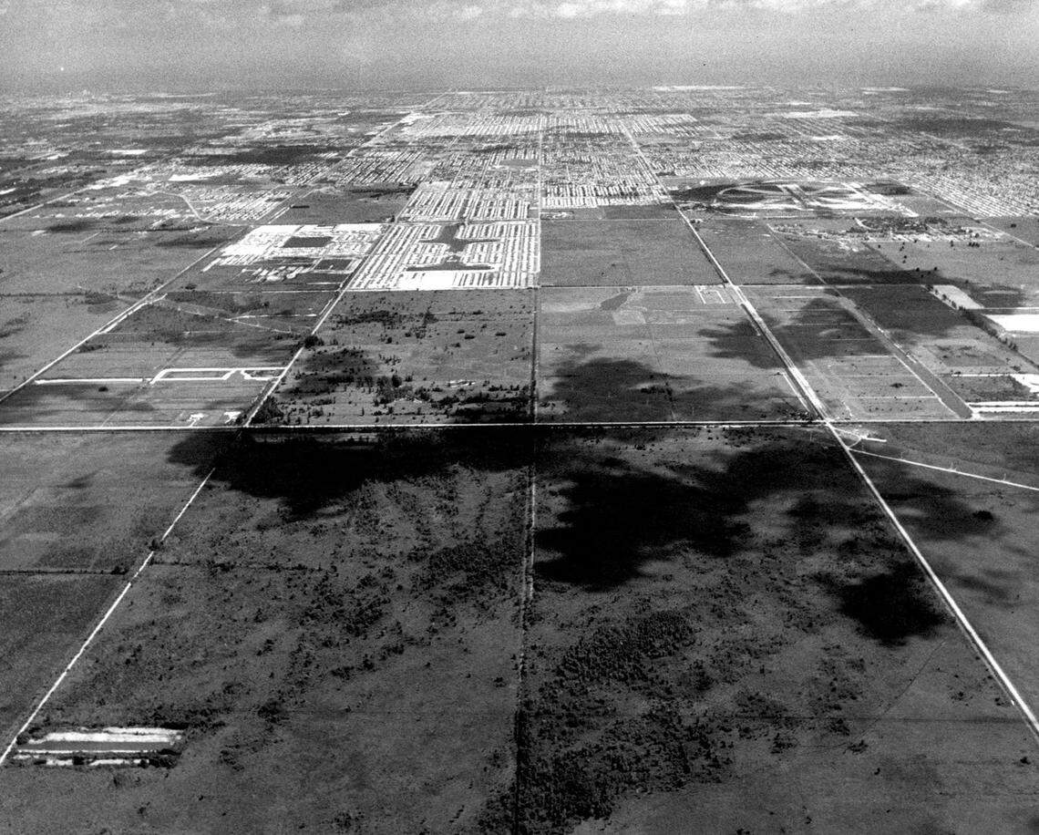 An aerial view of Pembroke Pines in 1970 looking east. Palm Avenue cuts across the center of the picture from left to right. At center from top to bottom is the unfinished Johnson Street. Pines Boulevard is at right and Taft Street at left. The wagon wheel pattern of runways at North Perry Airport is at right near the top of the picture. If the photograph were taken today, Pembroke Lakes Mall would be below the aircraft.