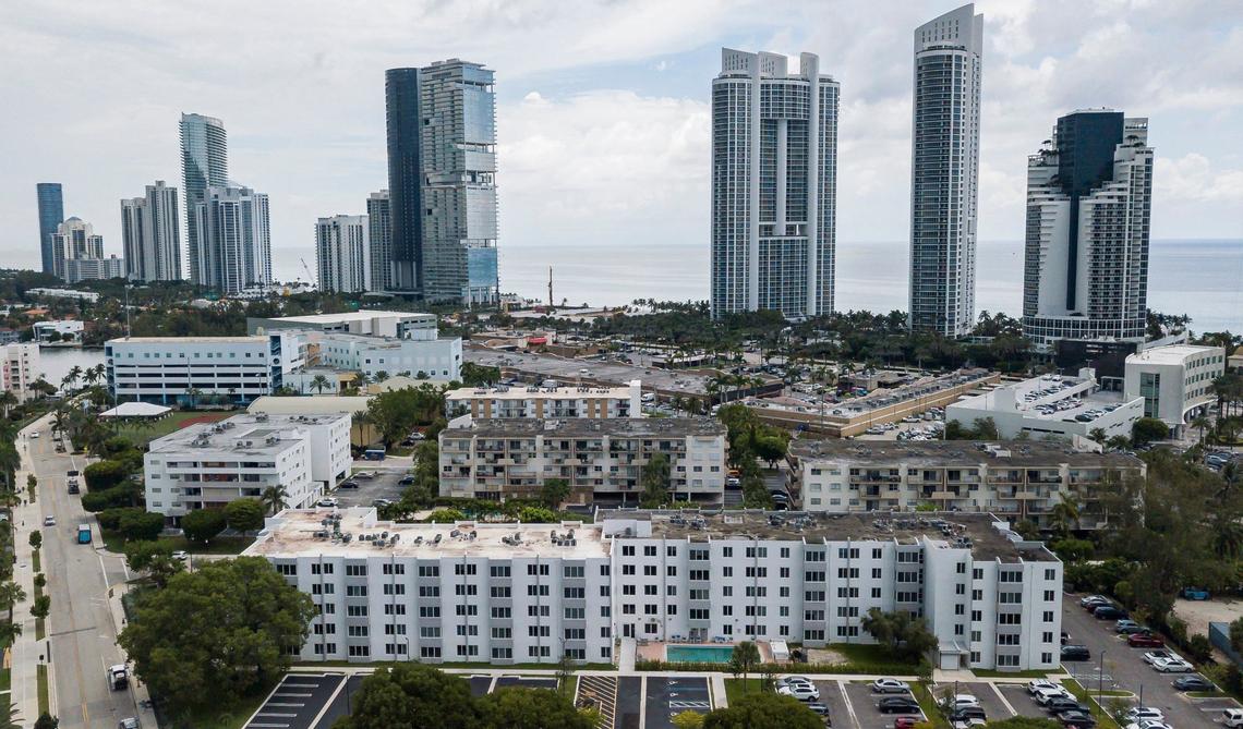 Aerial view of the Caribbean Breeze Condominium, bottom-center, on July 29, 2024, in Sunny Isles Beach. Some residents at the condominium pay over $800 a month in homeowners association fees, which has increased year after year.