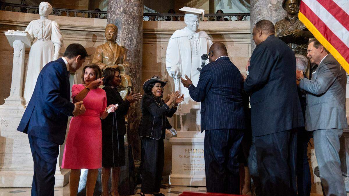 Speaker of the House Nancy Pelosi of Calif., second from left, gestures to Sen. Marco Rubio, D-Fla., as Rep. Val Demings, D-Orlando, and Rep. Frederica Wilson, D-Miami., center, react along with members of the Florida Congressional Delegation, during the unveiling of a state statue from Florida of Mary McLeod Bethune, in Statuary Hall, Wednesday, July 13, 2022, at the U.S. Capitol in Washington.