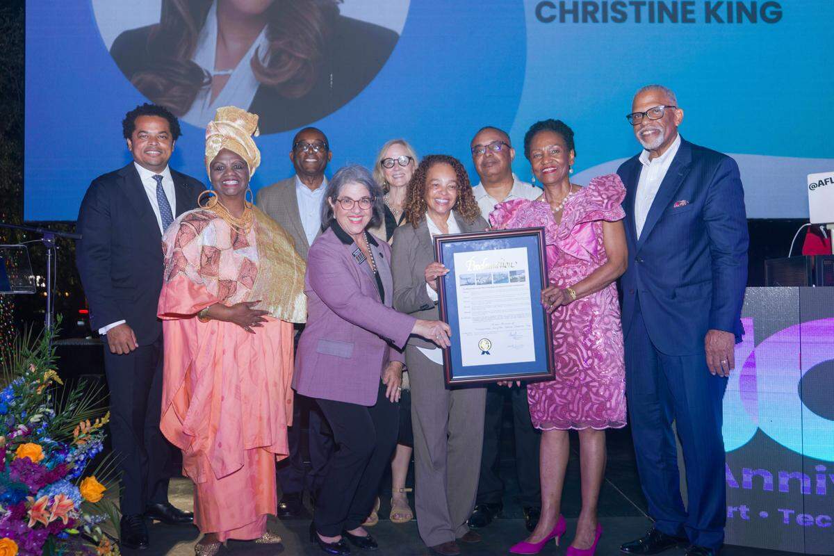 From left, front row: Miami-Dade County Commissioner Keon Hardemon, Miami-Dade School Board Member Dr. Dorothy Bendross-Mindingall, Miami-Dade County Mayor Daniella Levine Cava, Miami City Commission Chairwoman Christine King, Marilyn Holifield and Nelson Adams celebrate the 10th anniversary of the Miami Museum of Contemporary Art of the African Diaspora, Dec. 2, 2025, at the Historic Lyric Theater in Miami’s Overtown.