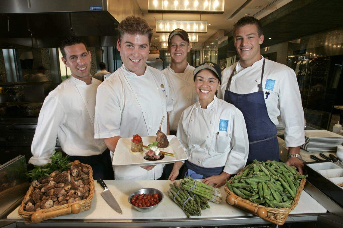 5/19/05 Al Diaz/Miami Herald--Miami--In 2005, chef Clay Conley and team ensemble at Azul restaurant at the Mandarin Oriental. Conley is holding the Moroccan lamb entree.