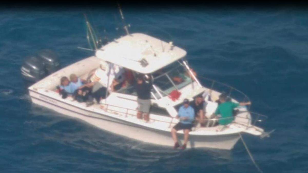 A Customs and Border Protection Air and Marine Operations flight crew spotted a suspicious vessel with twin outboard engines about 20 miles west of Anguilla Cay, Bahamas, on Dec. 5, 2021. Agents say the boat was smuggling migrants. U.S. authorities are dealing with a sharp increase in migration from both Cuba and Haiti to South Florida. On Sunday, Dec. 12, 2021, the Coast Guard rescued three people at sea off the Florida Keys who the Border Patrol says are Cuban migrants.