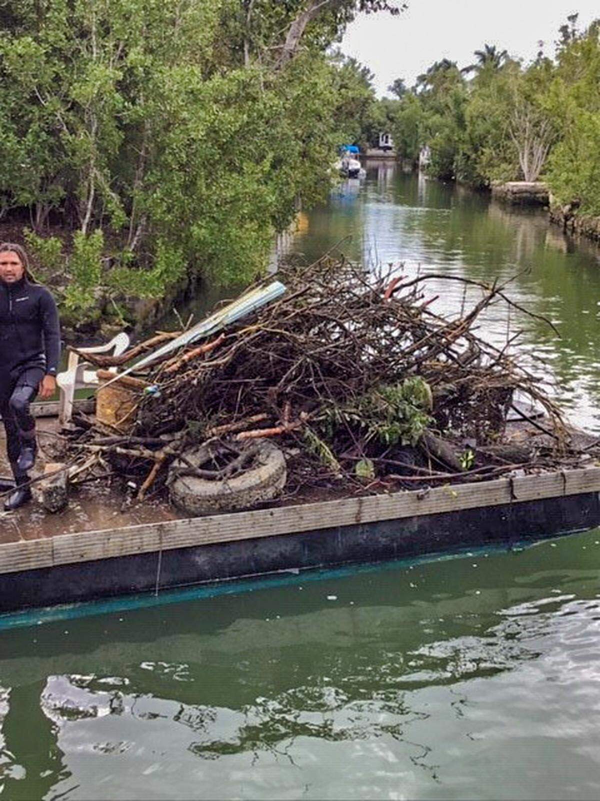 Debris is being removed from canal no. 229 on Big Pine Key.
