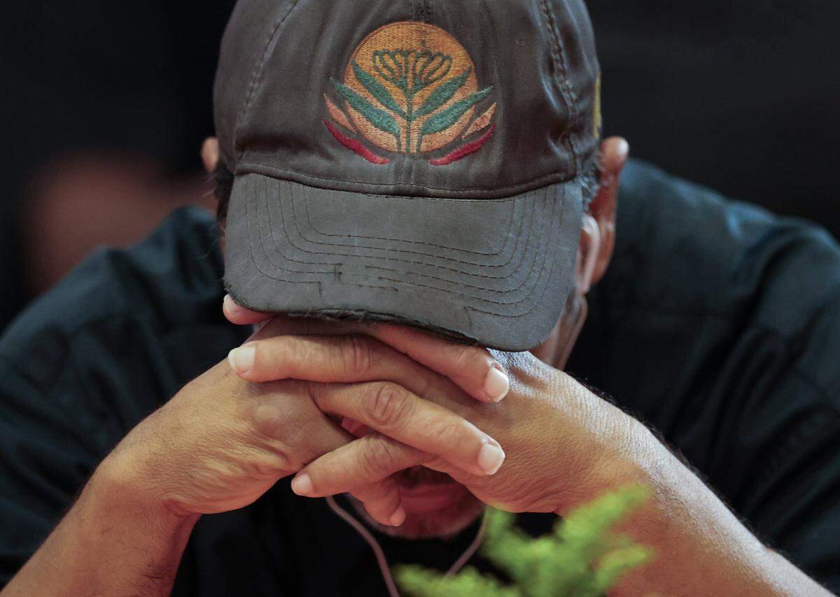 A client bows his heads in prayer.  Camillus House held its 65th annual Thanksgiving Celebration, a cherished tradition that brings hope, dignity, and fellowship to hundreds of individuals experiencing shelter insecurity with a Thanksgiving dinner and other activities at its main campus on Thursday, November 27, 2025, in Miami, Florida. 