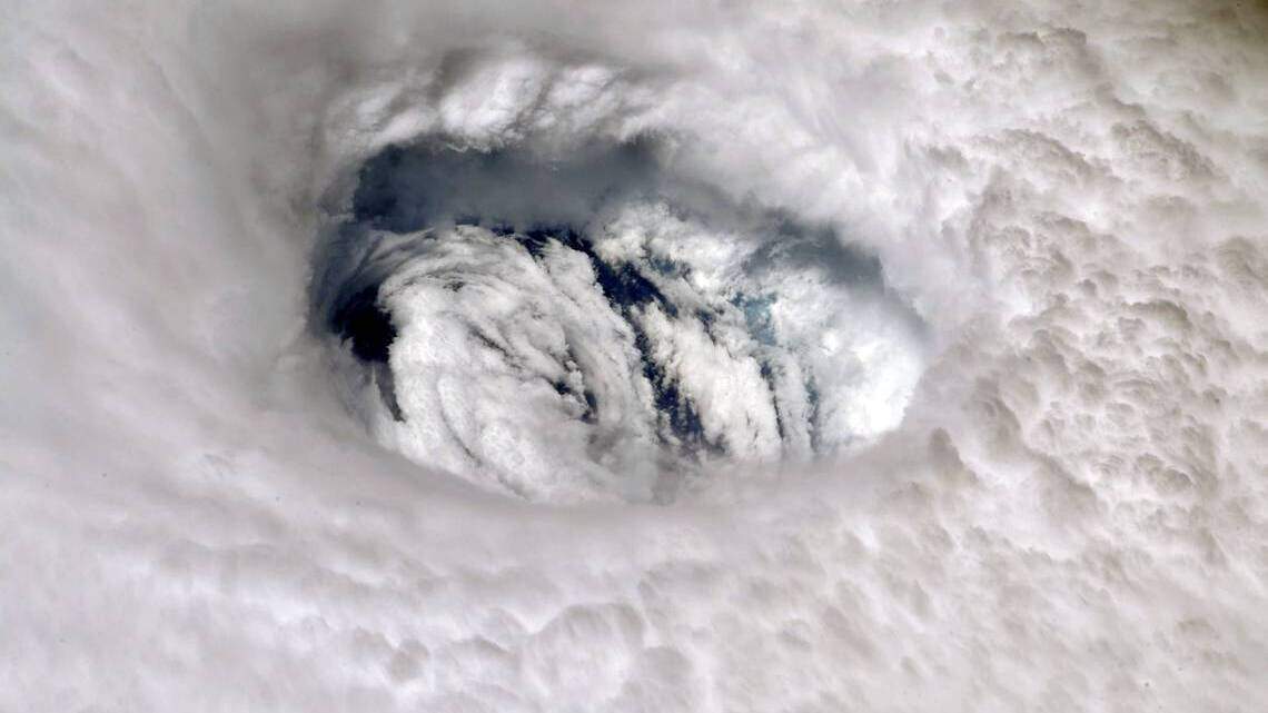 How common is it for Pacific storms like Agatha to cross into the Atlantic?