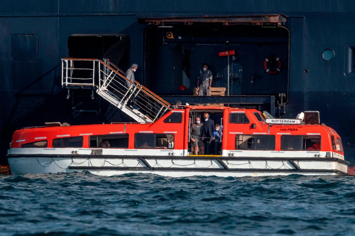 Passengers of Holland America’s cruise ship Zaandam are transferred to the Rotterdam cruise ship in Panama City bay on March 28, 2020. - Earlier Saturday, Panama’s maritime authority said healthy passengers were being evacuated from the Zaandam to another liner, the Rotterdam. The Zaandam cruise ship has been stranded at sea since March 14 after several South American ports refused to let it dock due to dozens of people aboard having shown flu-like symptoms. (Photo by Ivan PISARENKO / AFP) (Photo by IVAN PISARENKO/AFP via Getty Images)