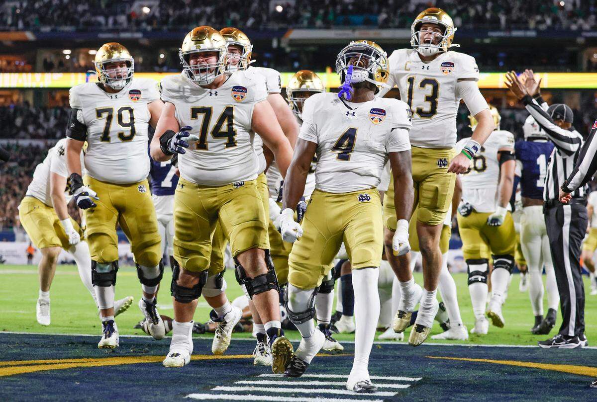 Notre Dame Fighting Irish running back Jeremiyah Love (4) celebrates with teammates after scoring in the second half against the Penn State Nittany Lions in their NCAA Playoff Semifinal Capital One Orange Bowl football game at Hard Rock Stadium in Miami Gardens, Florida on Thursday, January 9, 2025. 