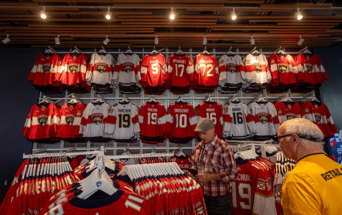 A man looks at Panthers merchandise at the store located in the newly constructed Baptist Health IcePlex in Fort Lauderdale.