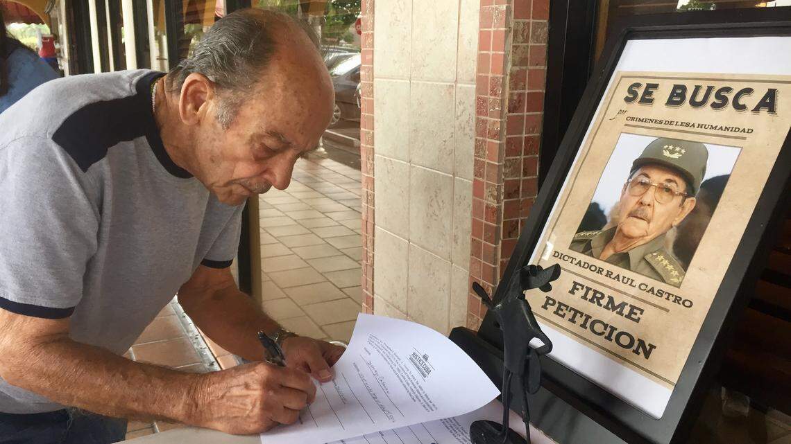 Domingo Cabrera signs a petition in Hialeah that calls for the indictment of Raúl Castro for the 1996 shoot-down of two Brothers to the Rescue planes and the deaths of four South Florida men.