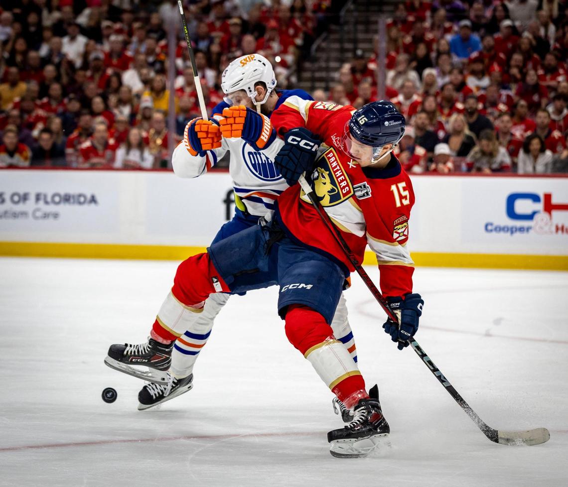 Panthers’ Center, Anton Lundell #15 fights for the puck with Edmonton’s Leon Draisaitl during the first period of Game 3 in the NHL Stanley Cup Final series at Amerant Bank Arena on Monday, June 9, 2025, in Sunrise, Fla.