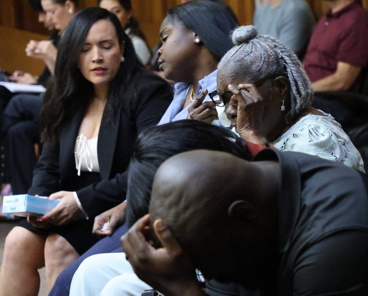 POOL PHOTO: Edwin Pata, the brother of Bryan Pata, lower right,  puts his head down while his mother, upper right, wipes away tearsas the judge reads a note indicating that jurors in the case of Rashaun Jones, who is accused of Pata, are deadlocked. Rashaun Jones, who is accused of killing his University of Miami football teammate Bryan Pata in 2006, appeared in Judge Cristina Miranda Courtroom 4-1 at the Richard E. Gerstein Justice Building in Miami, FL, on Monday, March 2, 2026.