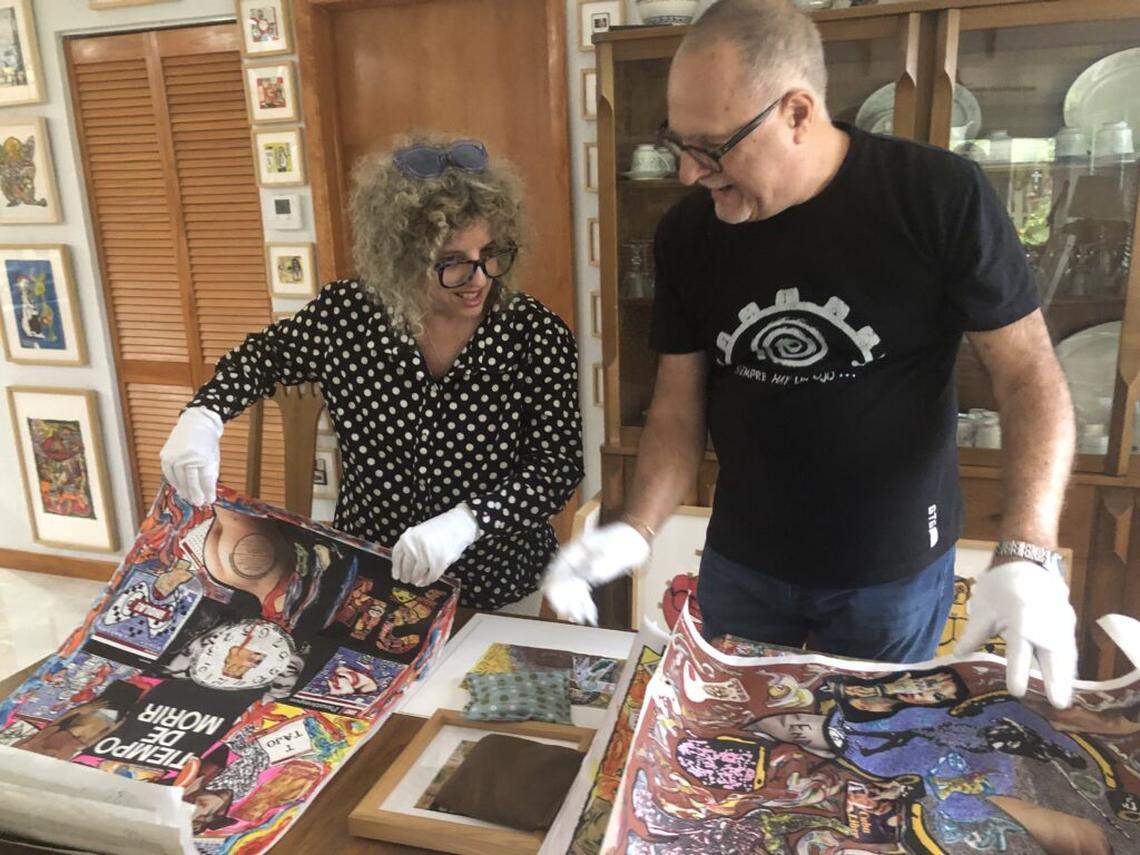 Curator Elvia Rosa Castro, left, and NAEMI founder Juan Martin review works for “No Seasoning”, drawn from the NAEMI Collection (National Art Exhibitions of the Mentally Ill), which opens Saturday Feb. 27 and continues through May 23 at North Miami’s Copperbridge Foundation.