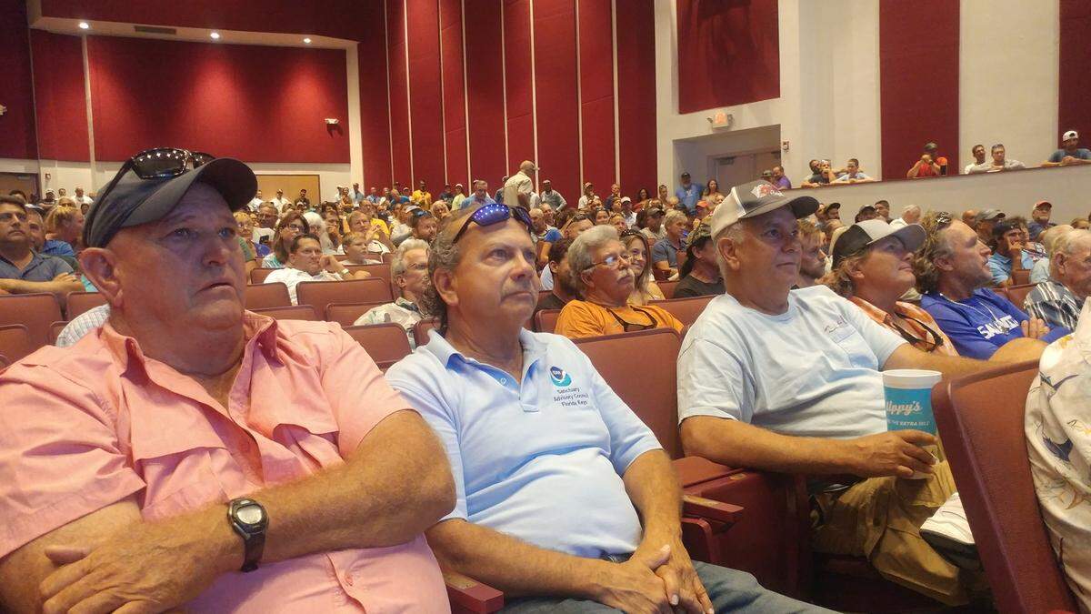 Richard Gomez, of the Key West Charter Boat Association, pictured center, listens to proposals from the Florida Keys National Marine Sanctuary along with other boat captains on Monday, Sept. 23, 2019.