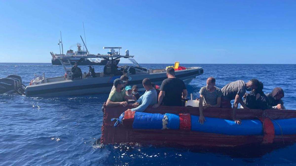 A U.S. Customs and Border Protection Air and Marine Operations boat crew and Coast Guard Cutter Charles Sexton’s small boat crew stop a vessel Thursday, Dec. 9, 2021, about 40 miles south of Key West.