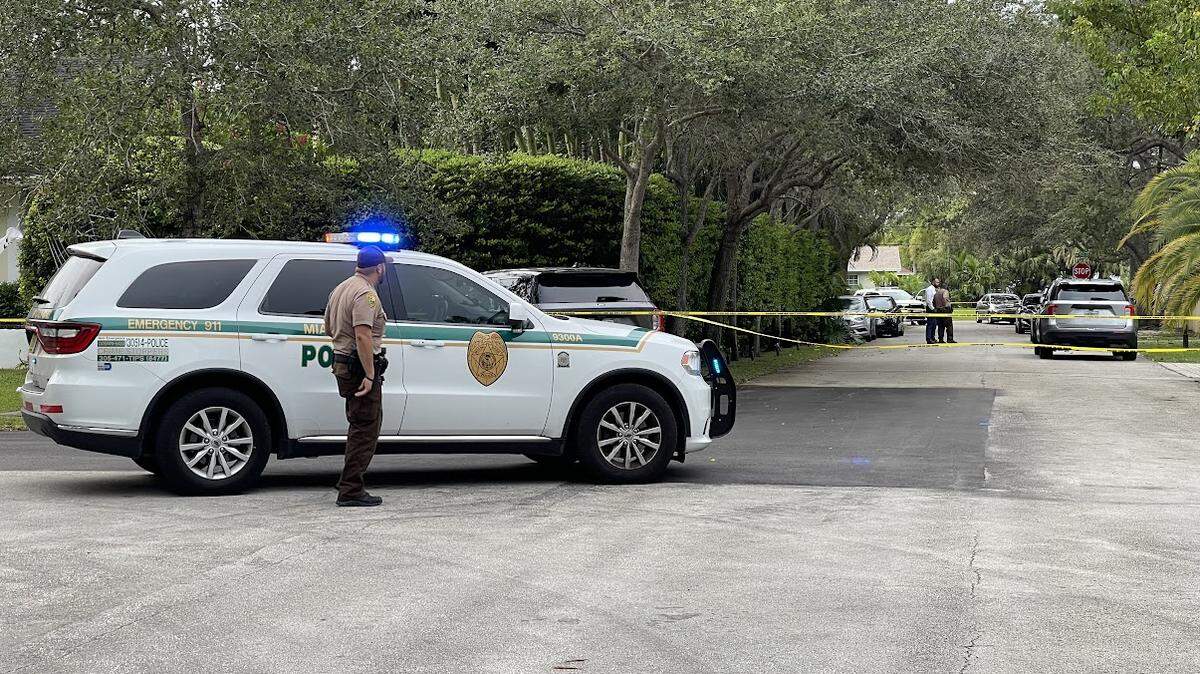 Officers block off a street while detectives investigate a fatal shooting in southwest Miami-Dade County Friday, Nov. 3, 2023.