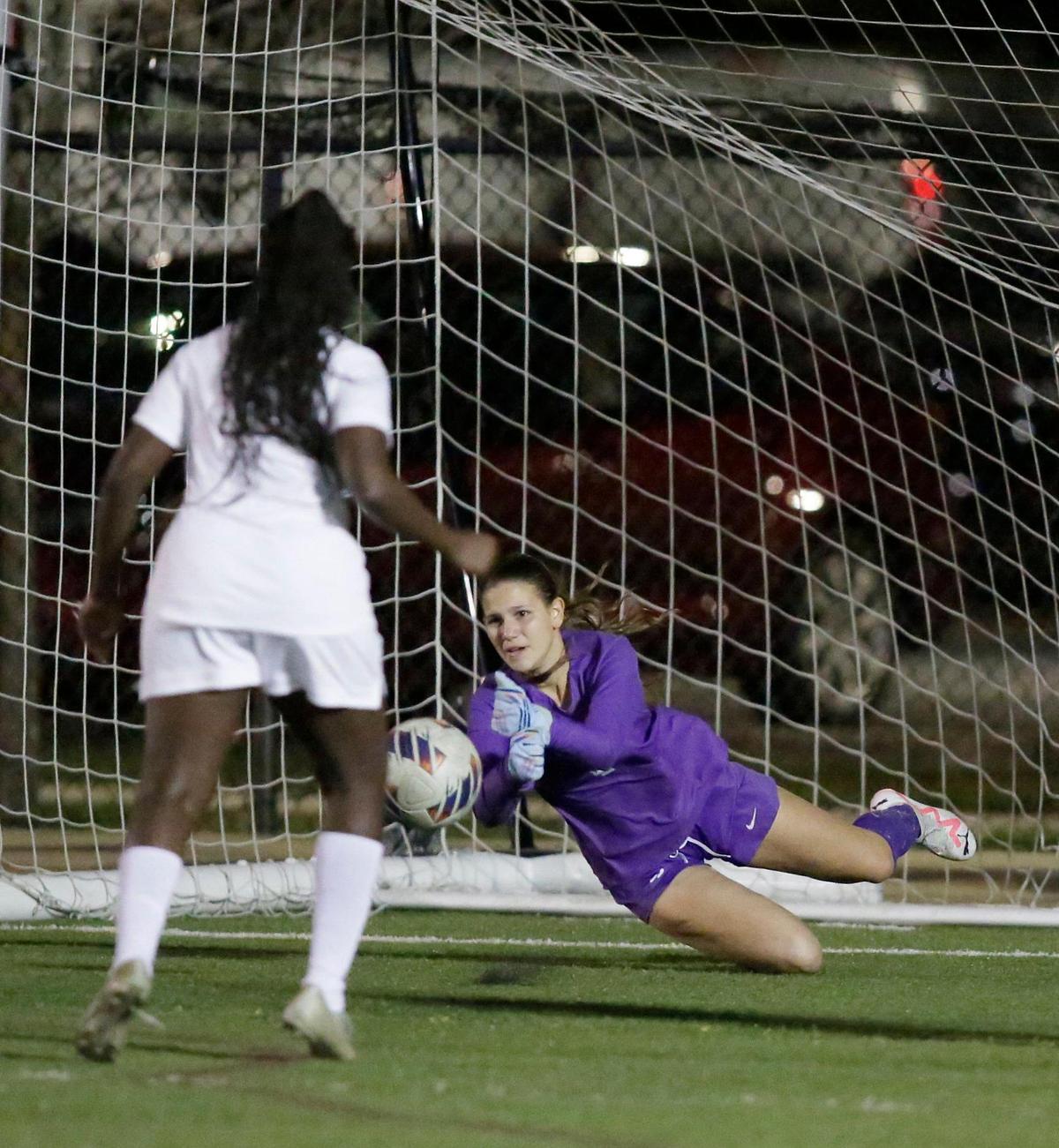 NSU University Sharks goalkeeper Avril Ramirez (1) makes a save during region 4-3A girls soccer final game against Miami Edison Red Raiders on Wednesday, February 14, 2024 at AutoNation Field in Davie. Andrew Uloza / for Miami Herald