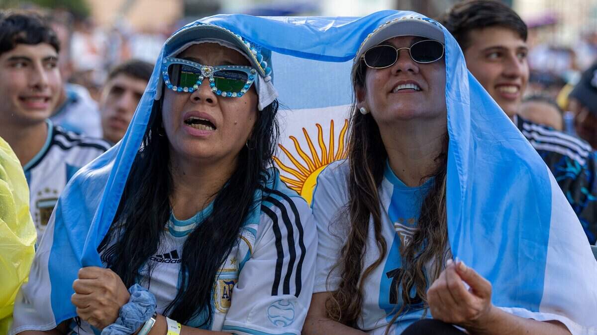 Rosana Huanco and Valerie Canete, right, watch Argentina play against Cape Verde at the FIFA Fan Festival 2026 in Bayfront Park on Friday, July 3, 2026, in downtown Miami, Fla.