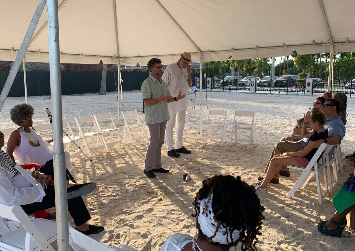 Corey Malcom in 2019 gives a history presentation in Key West beside a burial site of Africans rescued from the slave trade in 1860.