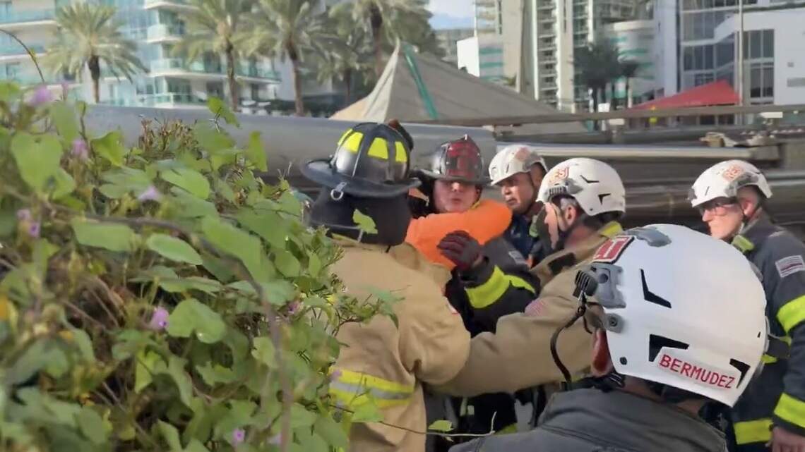 See ‘the famous hug’ after firefighter pulls man from construction-rig collapse