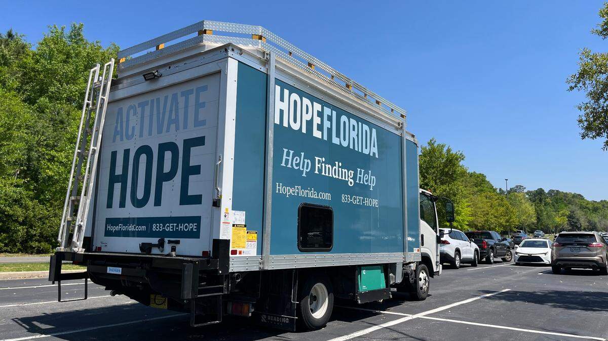 A Hope Florida truck seen outside the Florida Department of Children and Families in April. Lawmakers this session chose not to give $2 million to fund its help line.