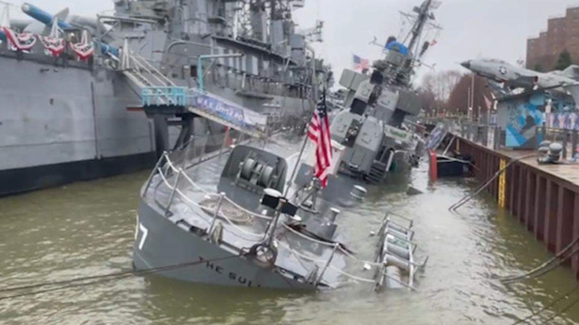 Photos show a World War II warship, USS The Sullivans, is sinking at a naval park in New York. It had a hull breach and is partly underwater, officials said.