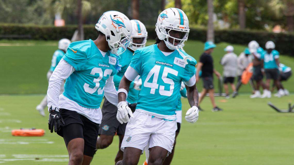 Miami Dolphins Cornerback Cornerback Jason Marshall Jr. (33) and Cornerback BJ Adams (45) run on the field together during a OTA’s “Organized Team Activities” workout session at the Baptist Health Training Complex on Wednesday, May 28, 2025, in Miami Gardens, Fla.