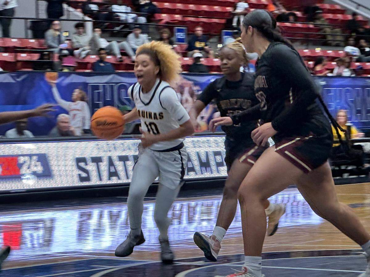 St. Thomas Aquinas guard Khadee Hession drives to the rim on Thursday during the Raiders’ 62-35 win over Wekiva in a Class 6A girls basketball state semifinal at the RP Funding Center in Lakeland, Fla.