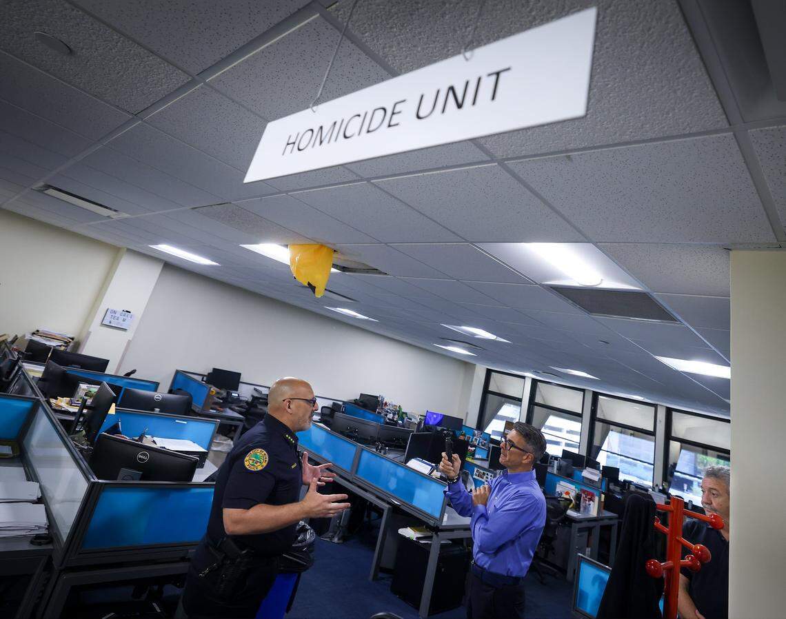 Miami Police Chief Manuel “Manny” Morales, left, gives a tour of the Homicide Unit to members of the press, where the ceiling leaks and water damage is evident. Miami Mayor Eileen Higgins toured the city's police and fire facilities in Miami, Florida on Monday, April 20, 2026. Higgins is proposing a general obligation bond to fund critical repairs and upgrades to aging public safety buildings, citing concerns over deteriorating conditions that threaten effective emergency response and community safety.