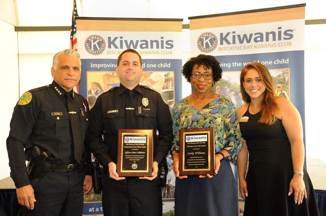Kellie Gayoso, right, president of the Biscayne Bay Kiwanis Club, is pictured with City of Miami Police Chief Jorge Colina, far left, during the club’s recent 2019 Educator of the Year and City of Miami Police Officer of the Year awards. The winners were Detective John Calabrese, second from left, and Principal Cathy Williams, second from right.