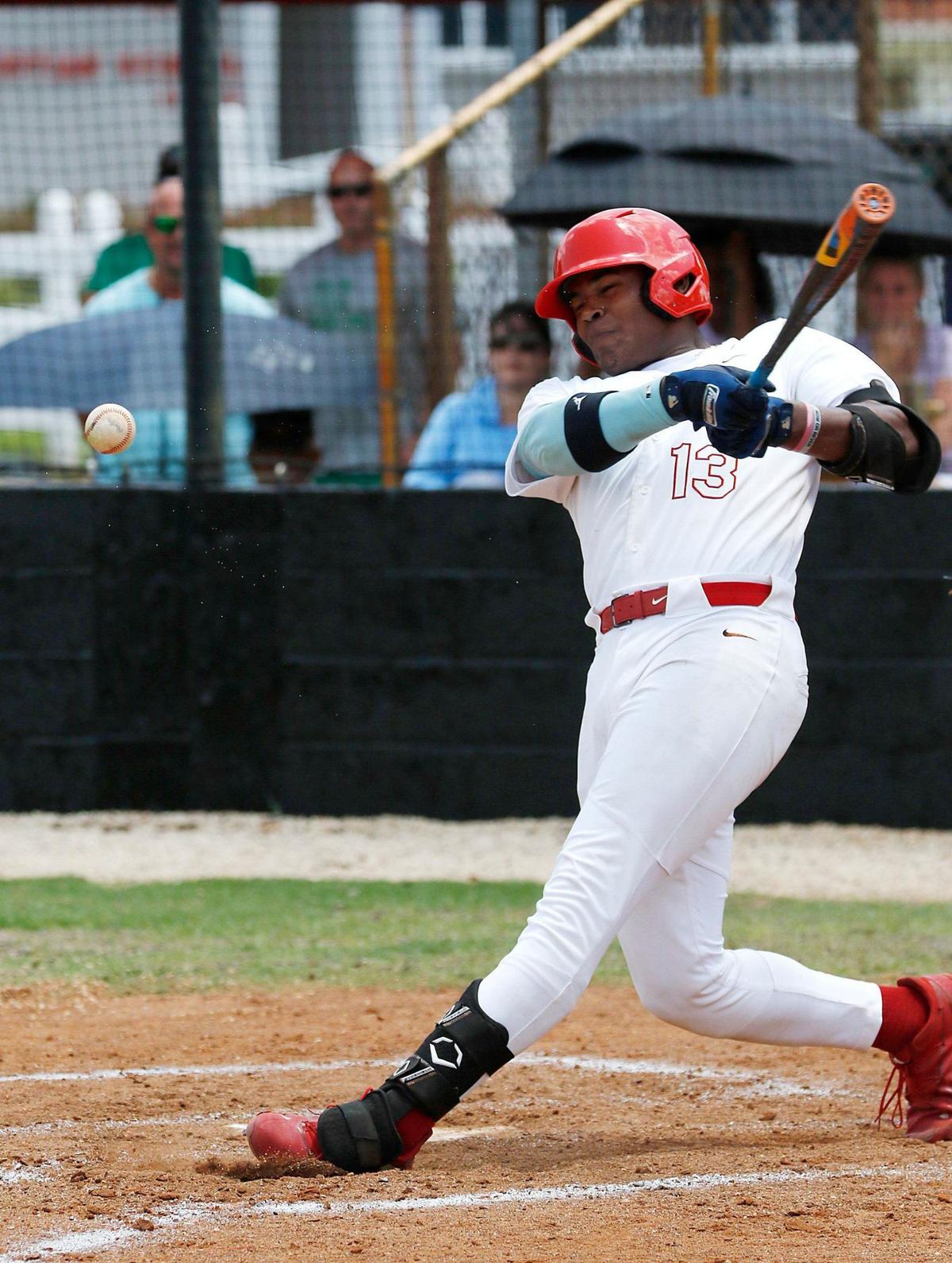 Miami Christian batter Cristian De Los Santos (13) hits against Westminster Academy during regional semifinal baseball game on Saturday, May 11, 2024 at Miami Christian HS in Miami. Andrew Uloza / for Miami Herald